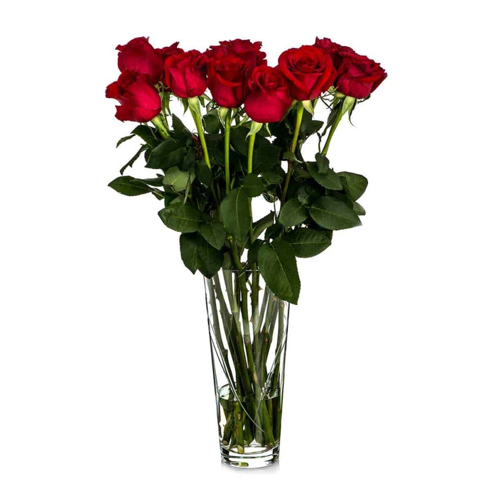 Tall crystal vase with red roses