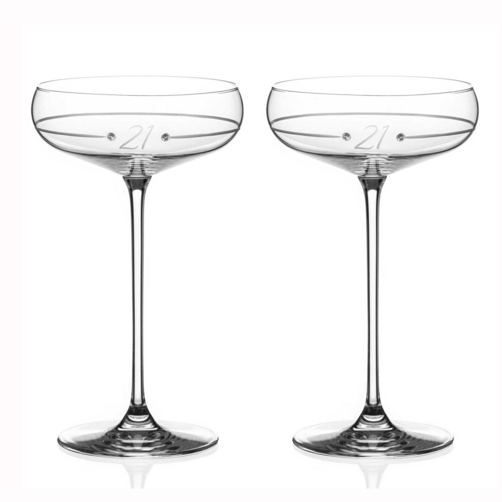 Pair of crystal birthday champagne sauces with etched 21